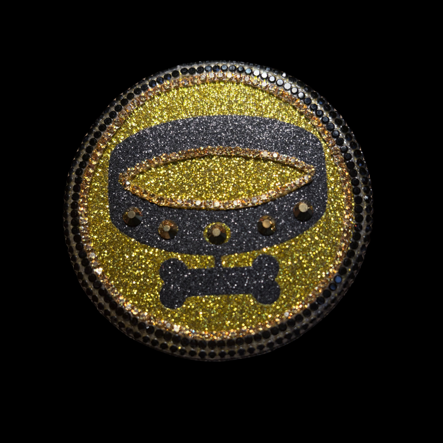 Decorative patch with a belt and bone design on a black background