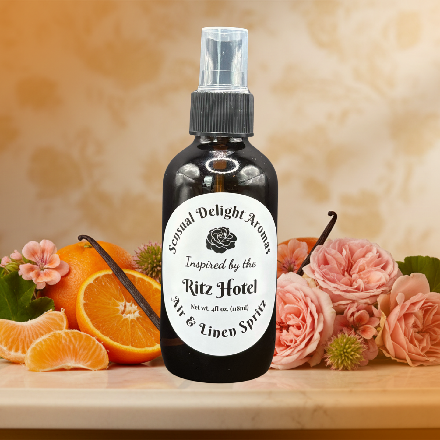 Bottle of 'Sexual Delight Aroma' Ritz Hotel air and linen spray with flowers and oranges on a wooden surface.