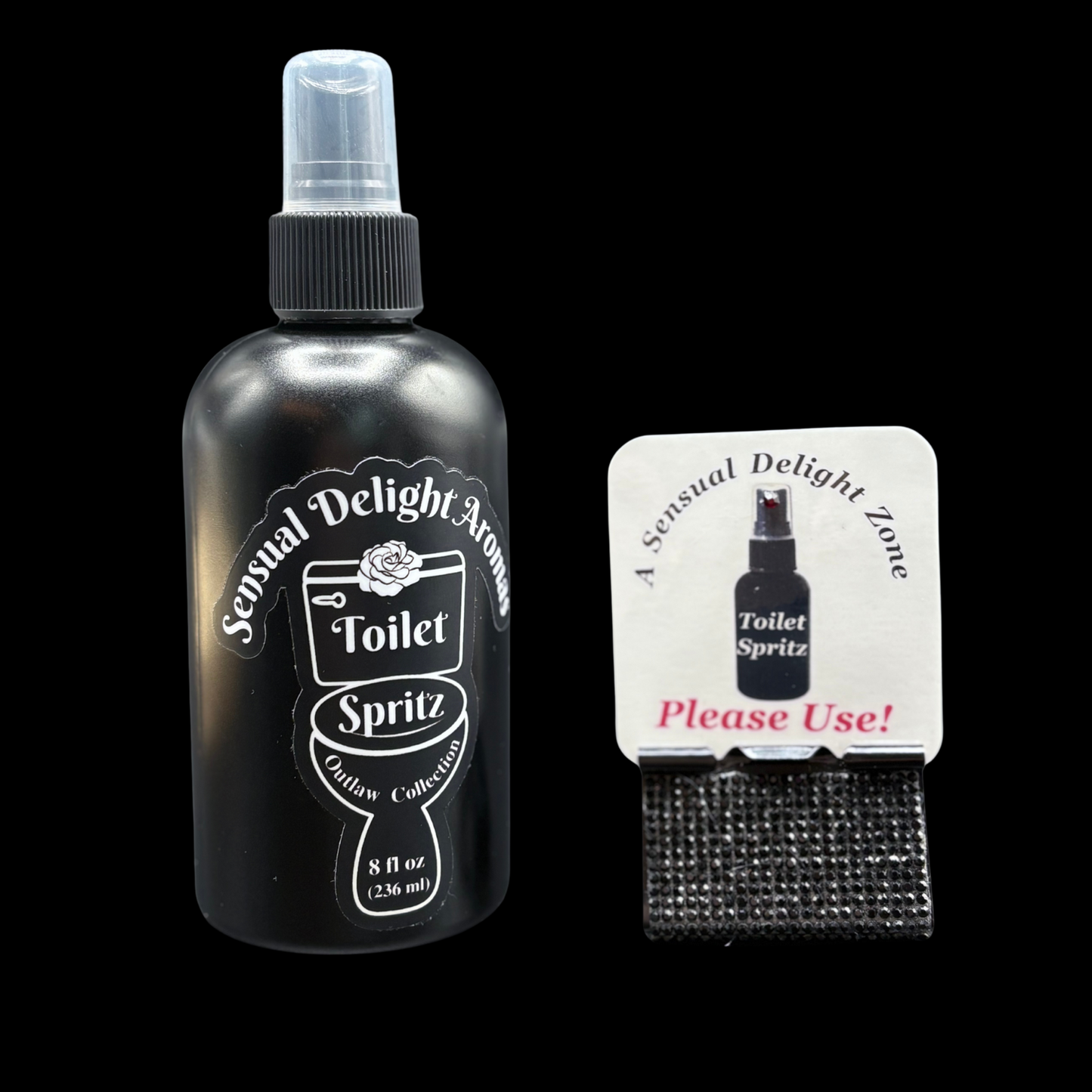 Black spray bottle labeled 'Toilet Spritz' with a matching sign on a black background