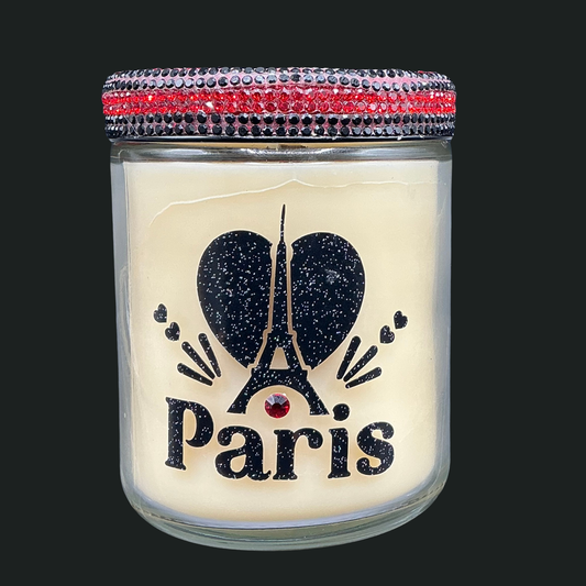 Candle in a glass jar with 'I love Paris' design and decorative lid.