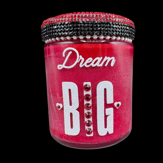 Red jar with 'Dream Big' text and decorative elements on a black background