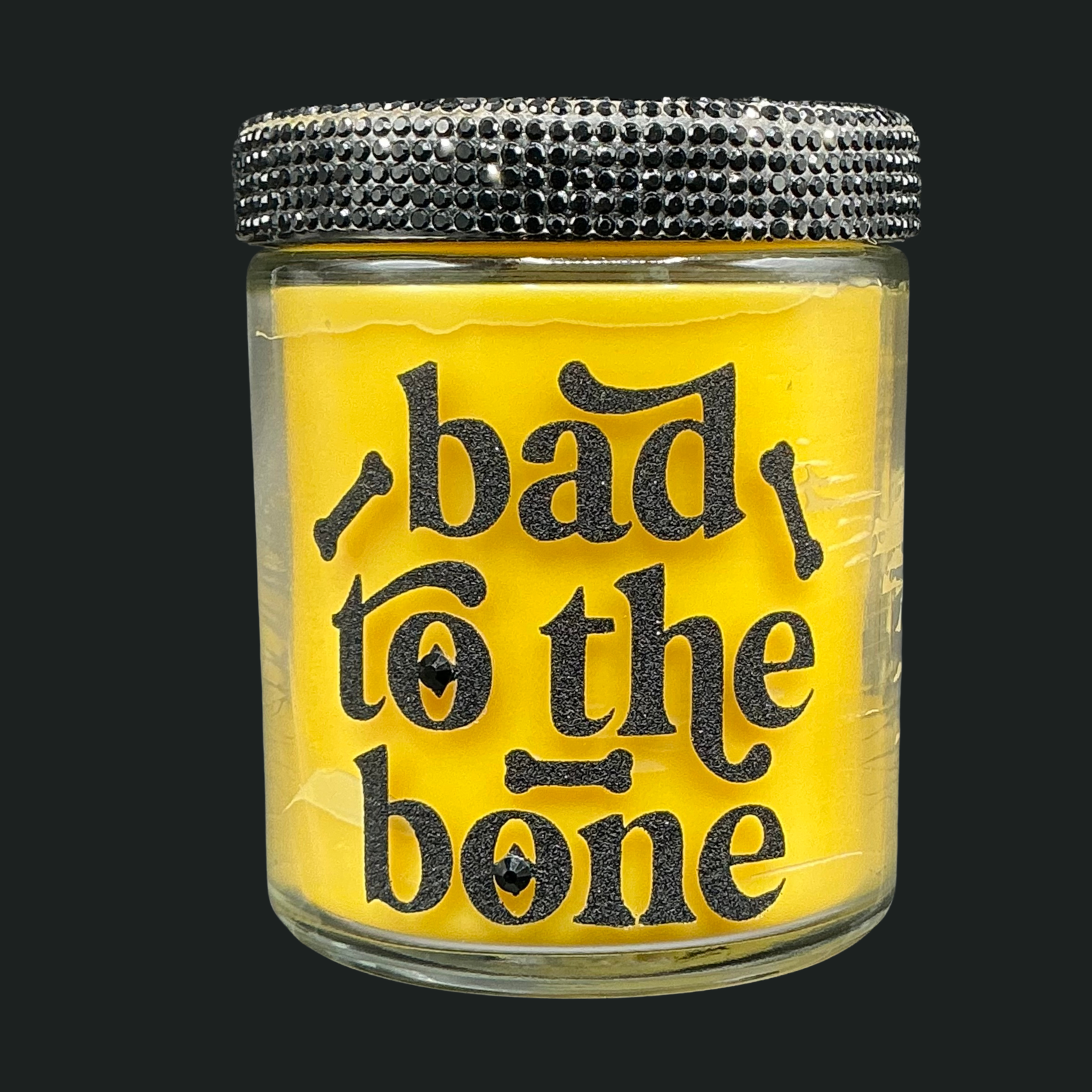 Jar with 'bad to the bone' text on a yellow background