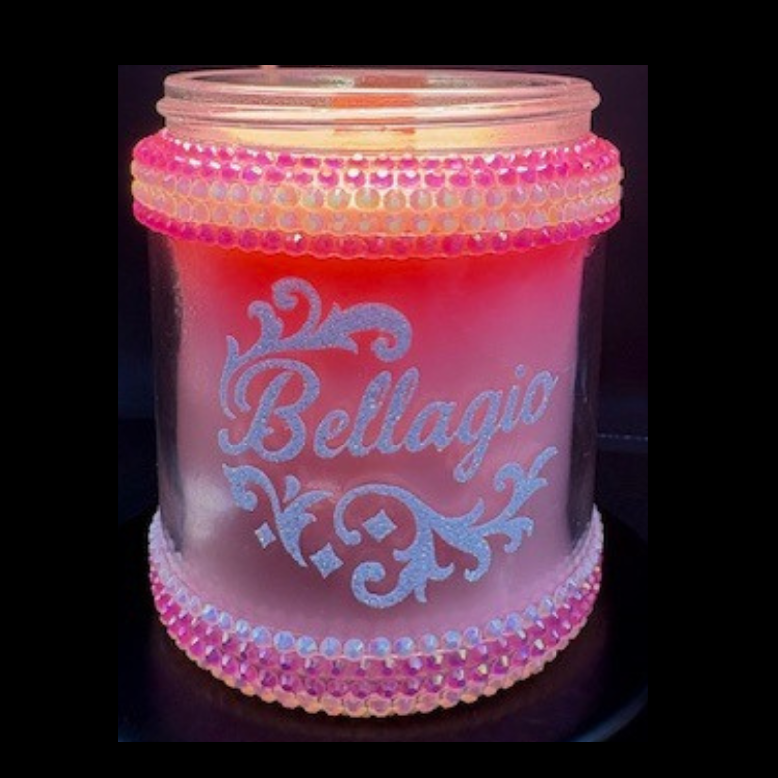 Pink beaded jar with 'Bellagio' text on a dark background