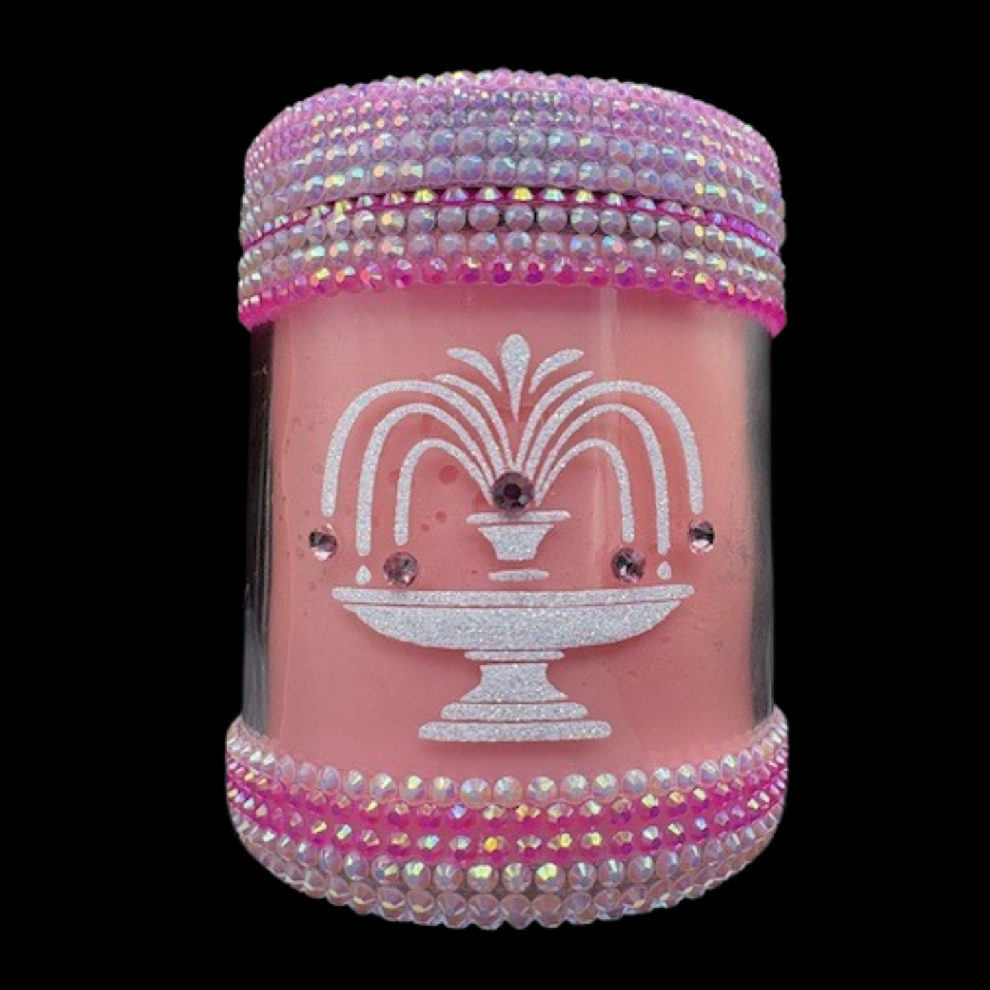 Pink decorative jar with fountain design and rhinestone embellishments on a black background