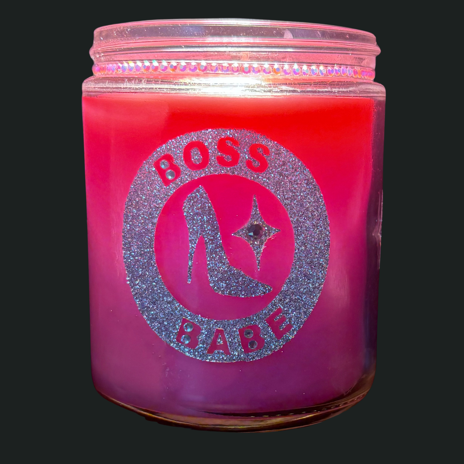 Pink candle jar with 'Boss Babe' text and design on a black background