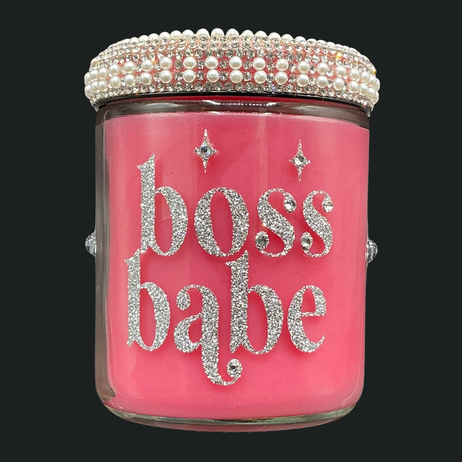 Pink jar with 'boss babe' text and decorative lid on a black background