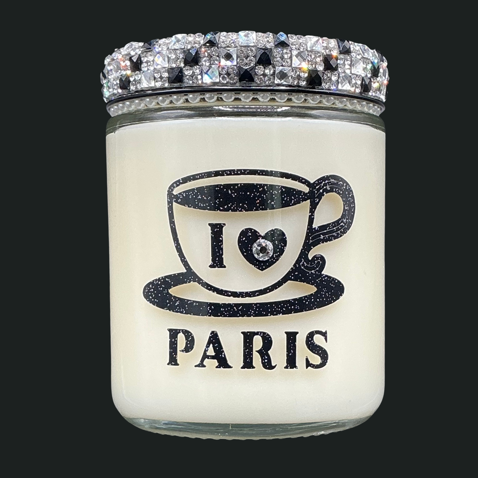 Candle jar with 'I ❤️ PARIS' text and decorative lid on a black background