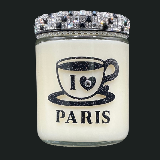 Candle jar with 'I ❤️ PARIS' text and decorative lid on a black background