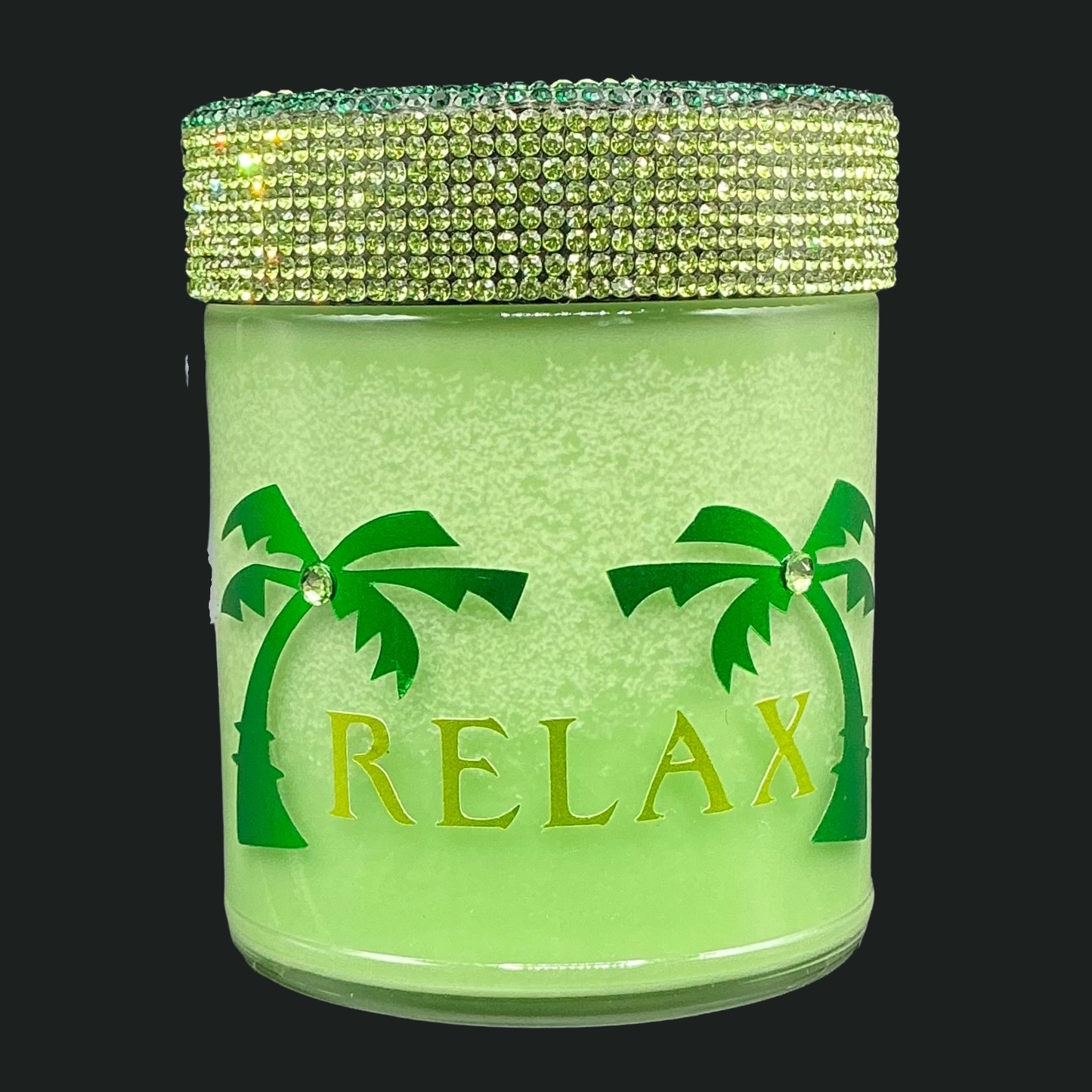 Green jar with palm tree designs and 'RELAX' text on a black background