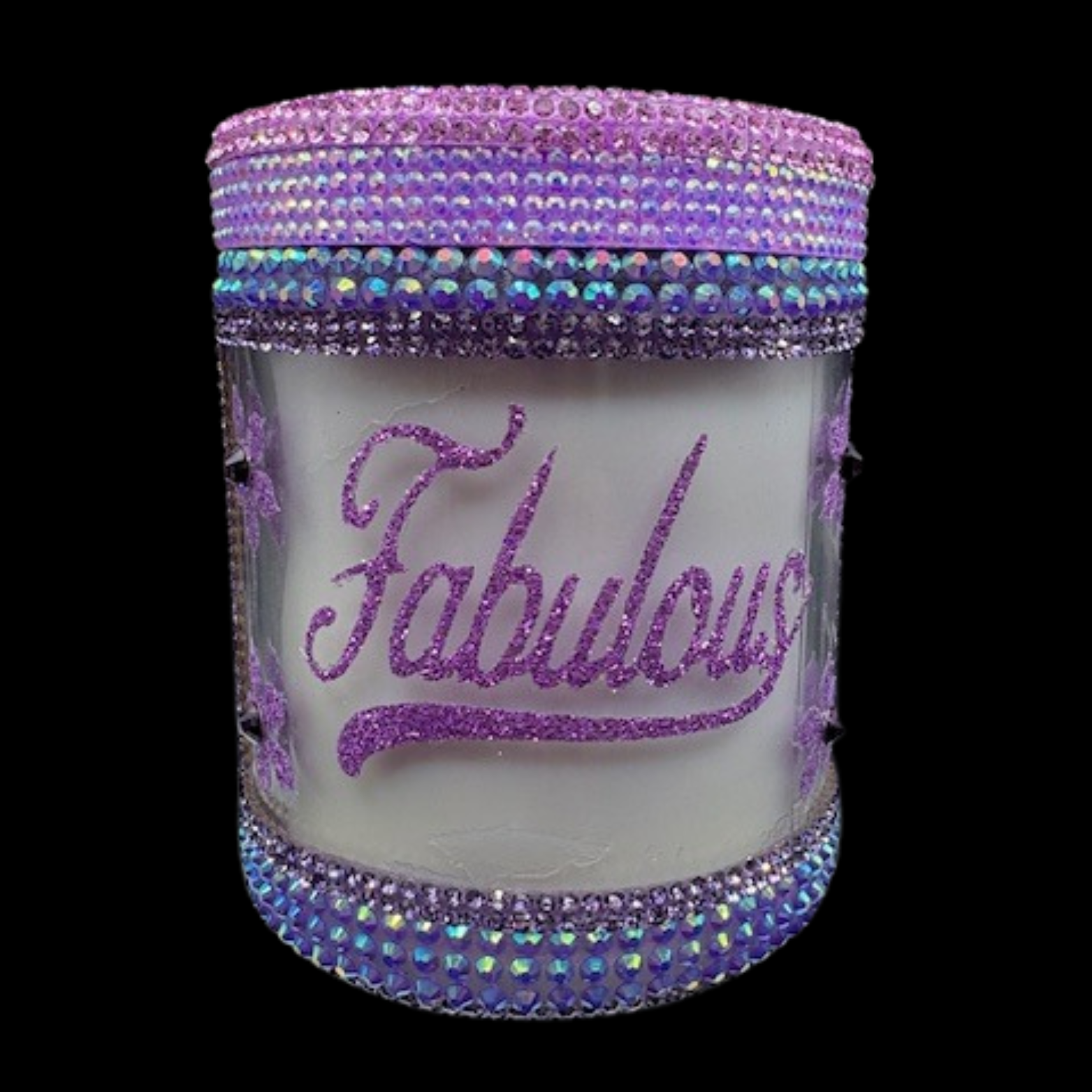 Decorative jar with 'Fabulous' text and purple rhinestone embellishments on a black background