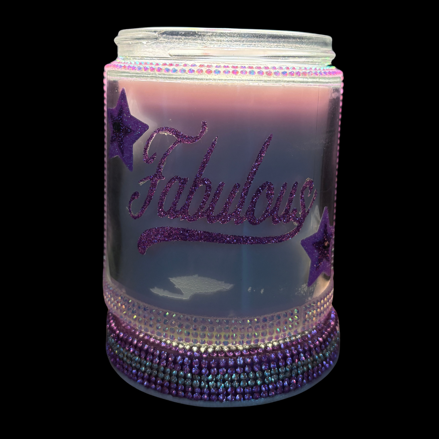 Decorative jar with 'Fabulous' text and purple accents on a black background