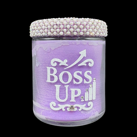 Purple jar with 'BOSS UP' text and decorative lid on a black background