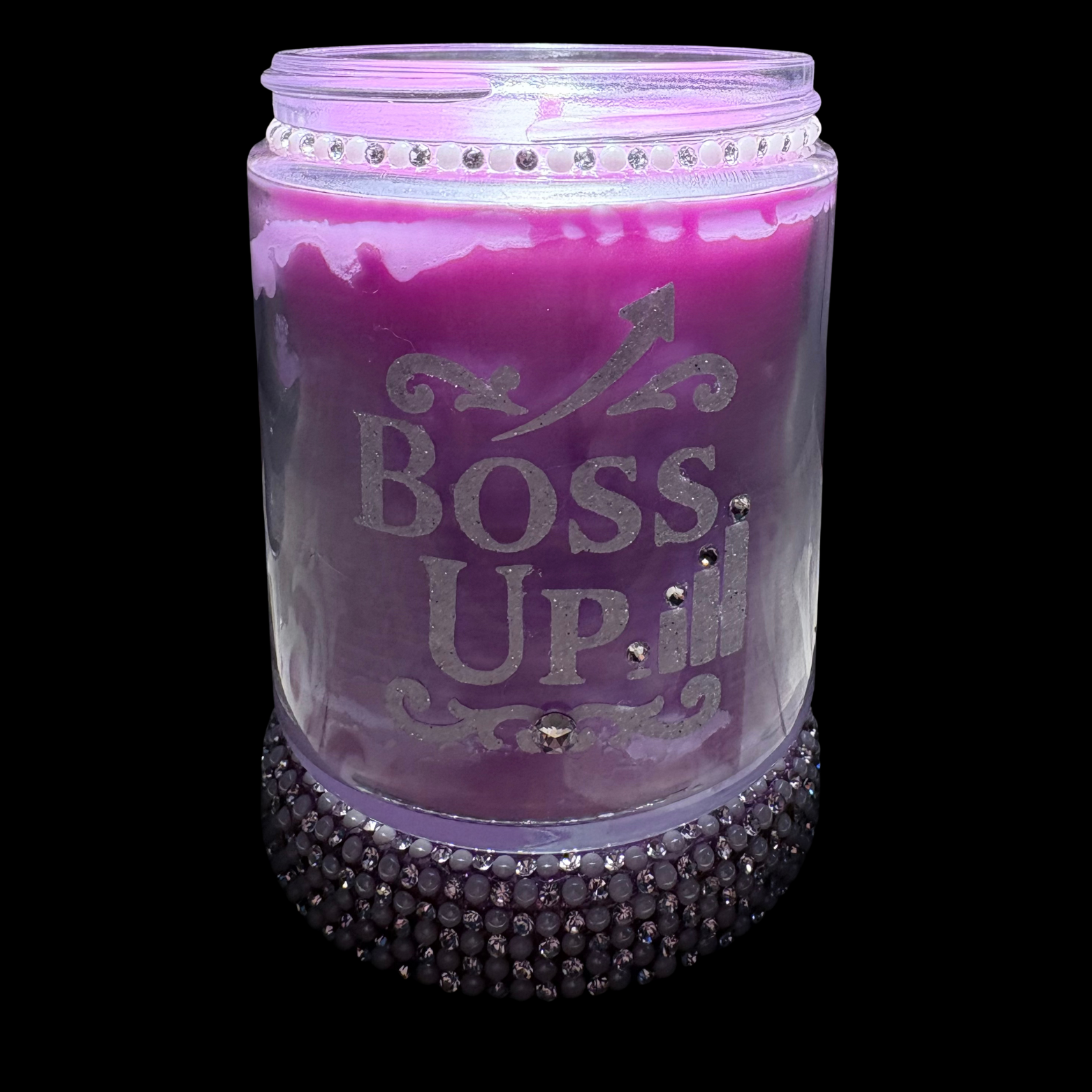 Purple candle jar with 'BOSS UP' text and decorative elements on a black background