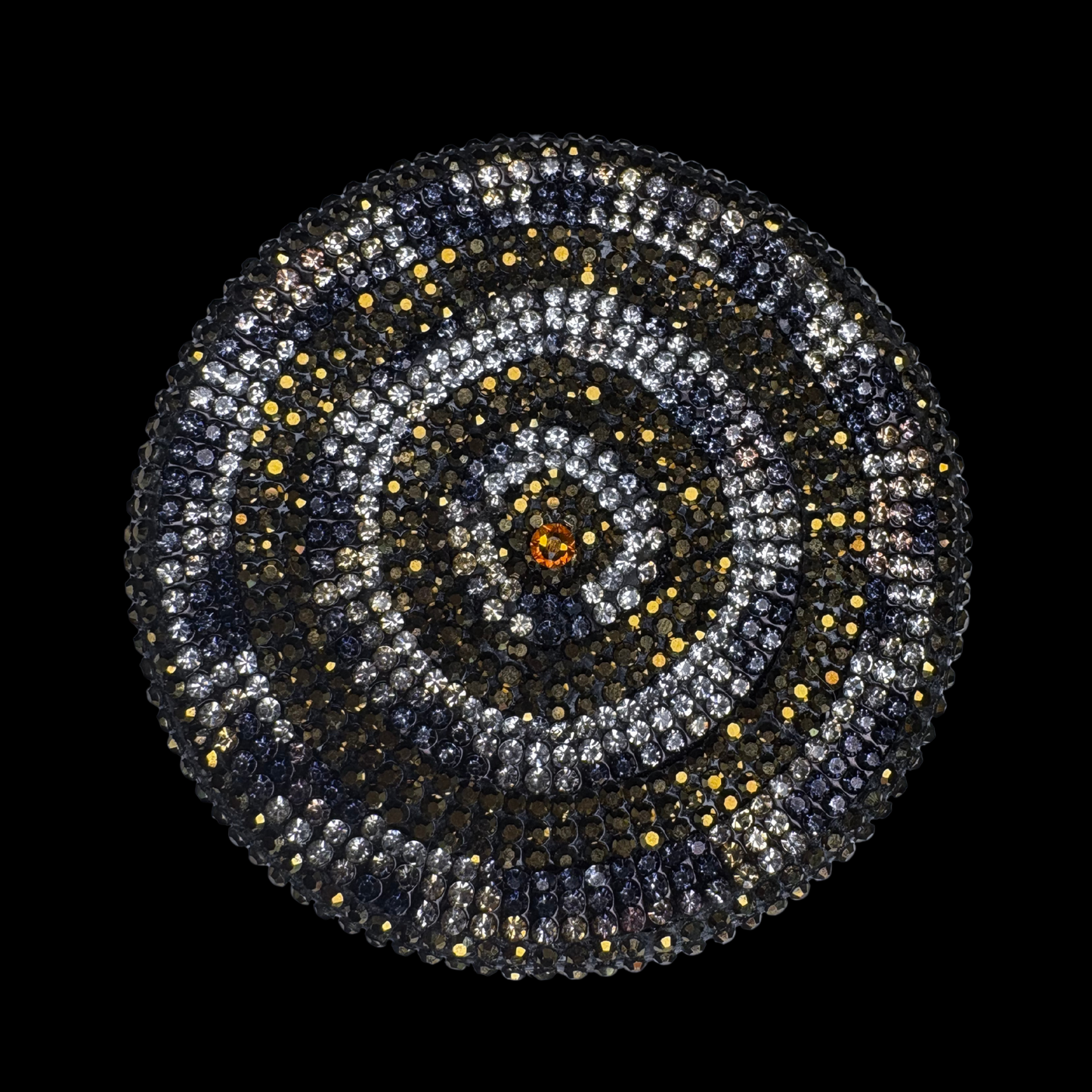 Circular pattern with concentric circles of stones on a black background