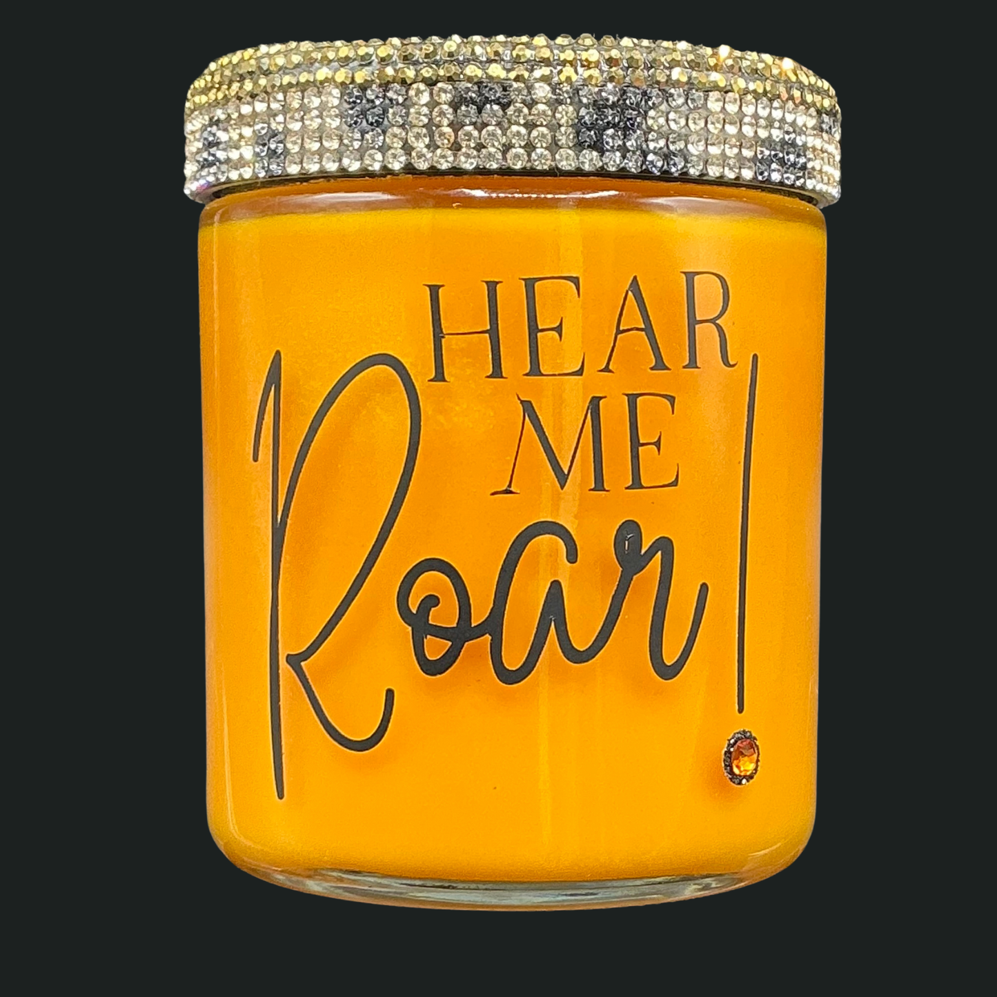 Orange jar with 'HEAR ME ROAR!' text and decorative lid on a black background