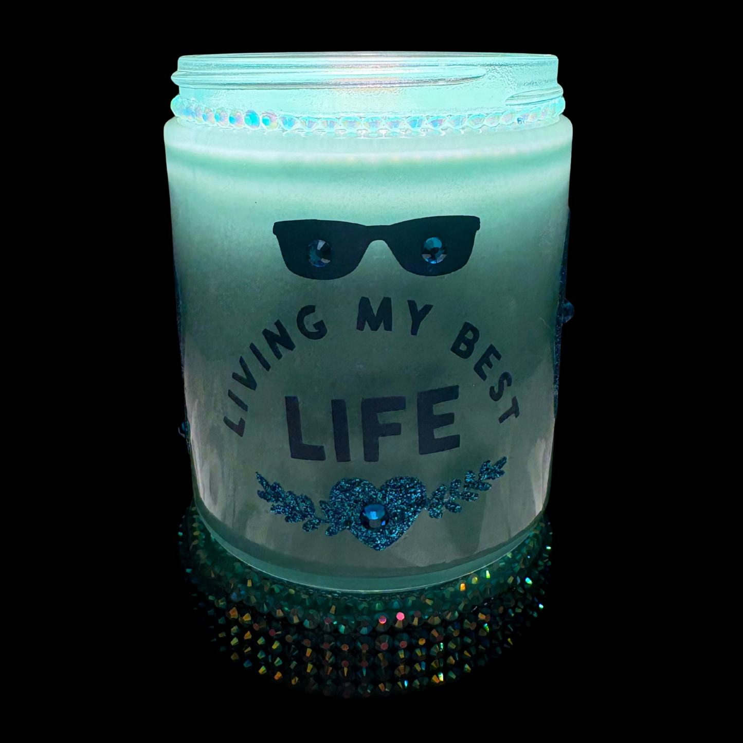 Glowing jar with 'Living My Best Life' text and sunglasses design on a black background