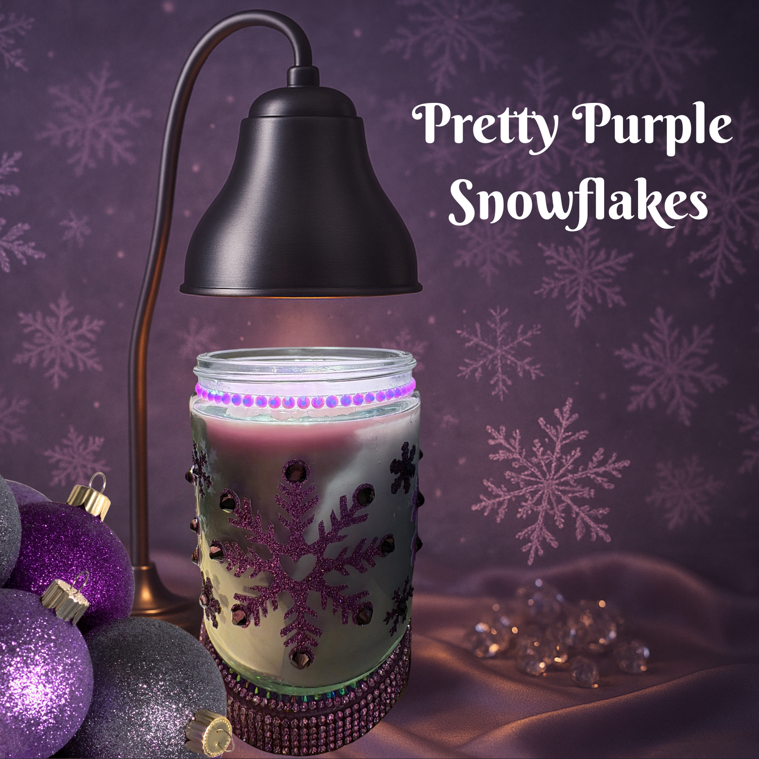 Decorative candle with purple snowflake design on a purple background with text 'Pretty Purple Snowflakes'.