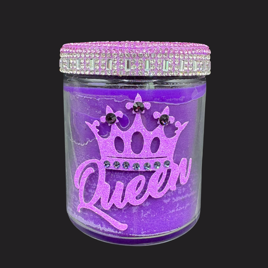 Purple jar with 'Queen' and crown design, decorated with rhinestones on a black background