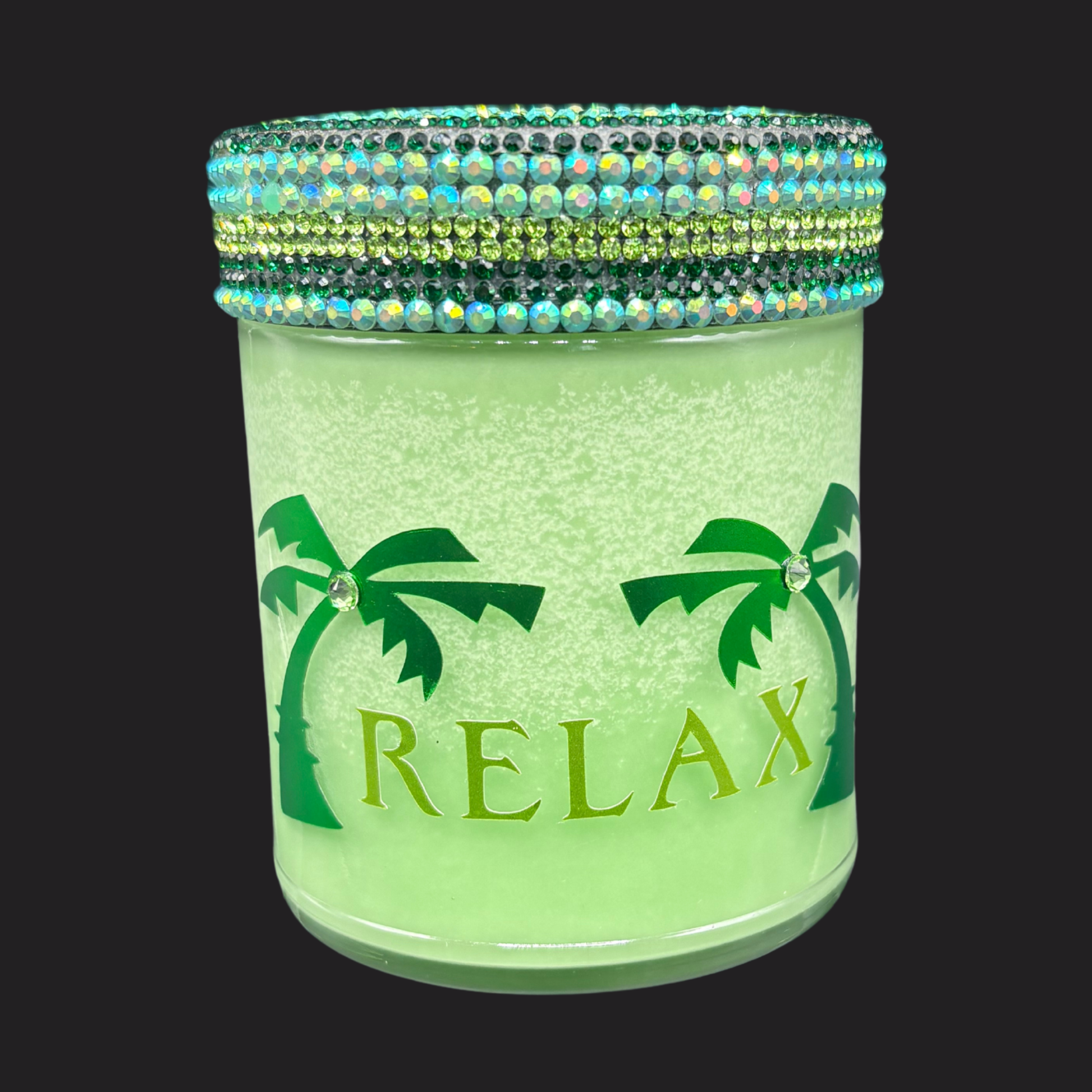 Green jar with palm tree design and 'RELAX' text, decorated with colorful beads on a black background.
