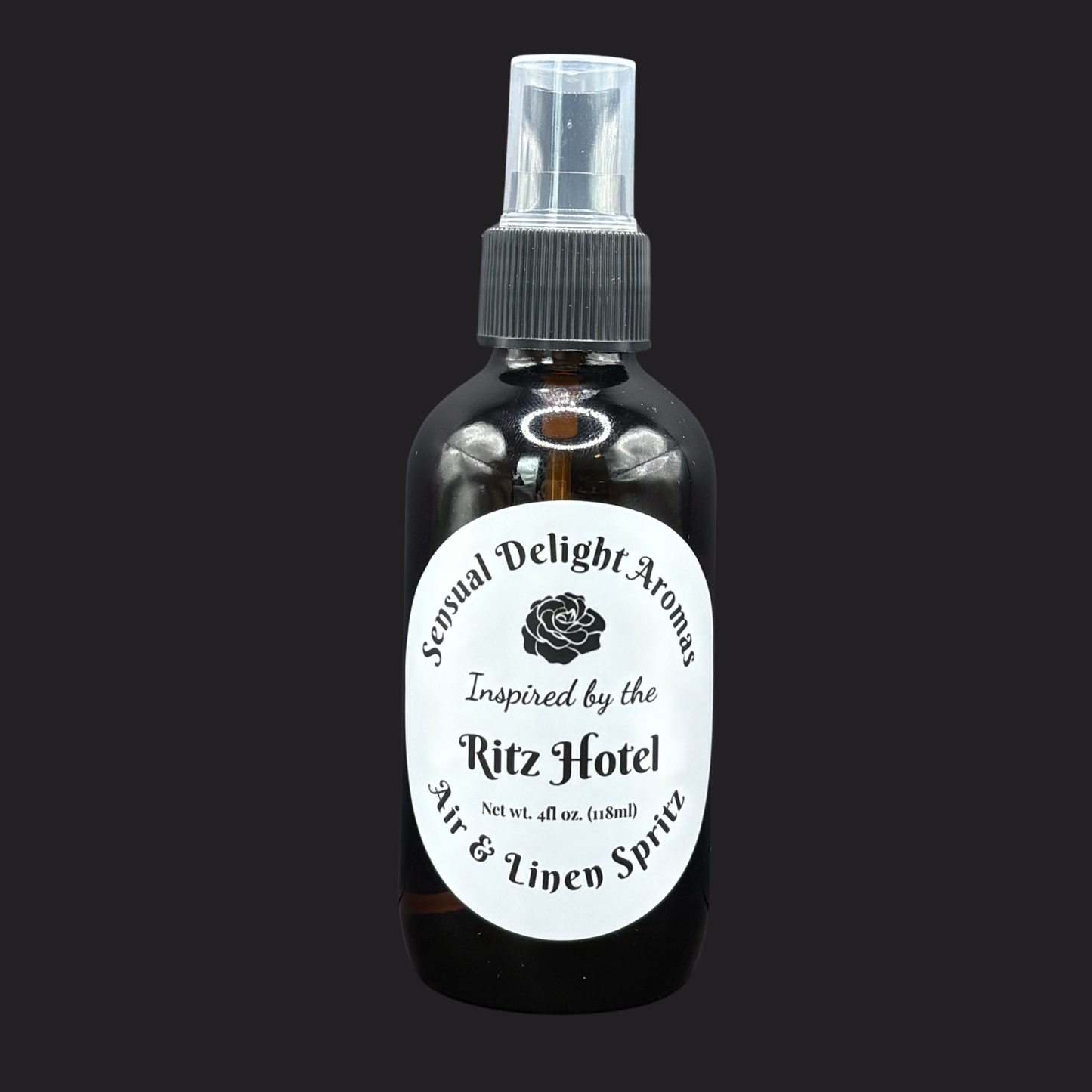 Bottle of 'Sensual Delight Aromas' air and linen spray inspired by the Ritz Hotel on a black background.
