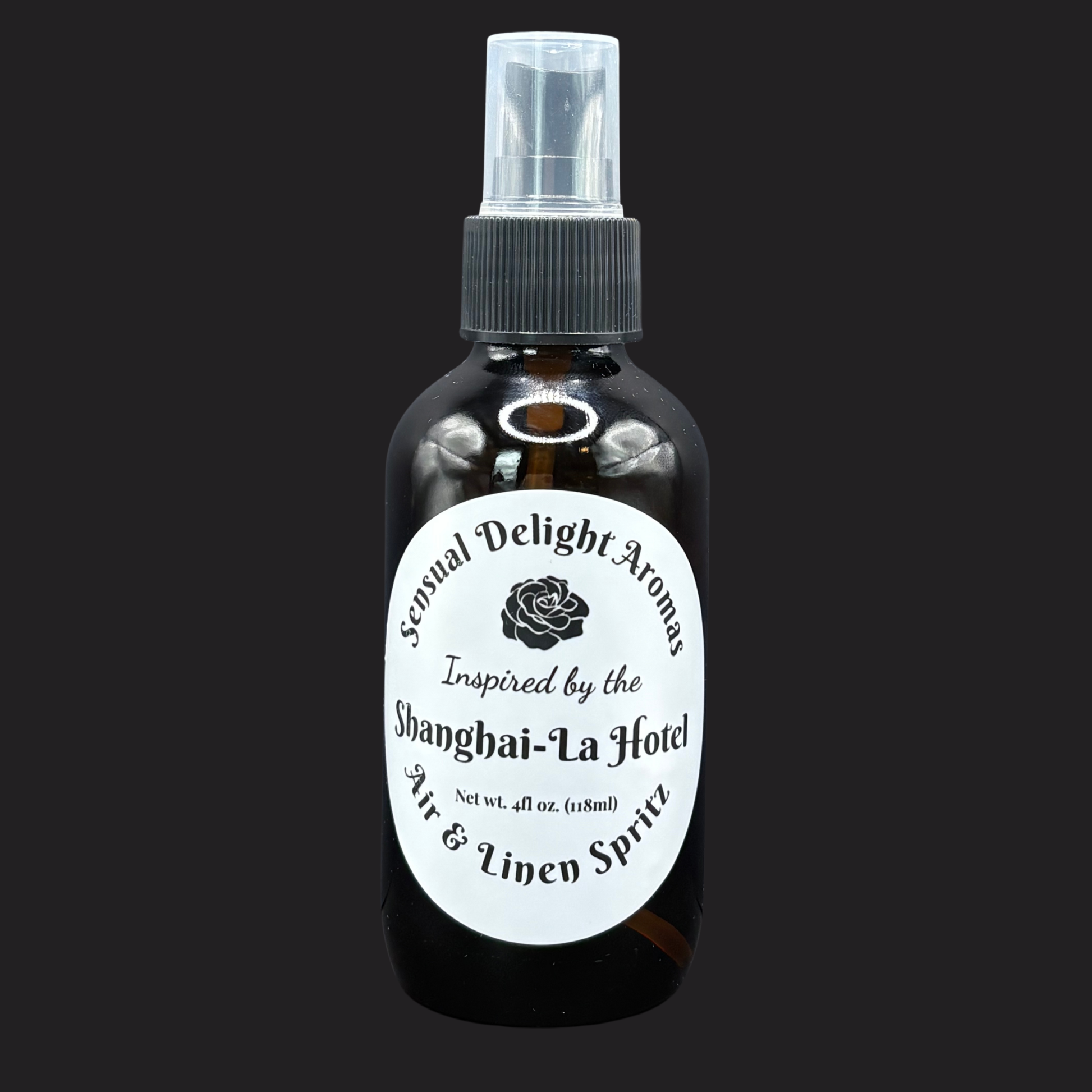 Bottle of air and linen spray with a label on a black background