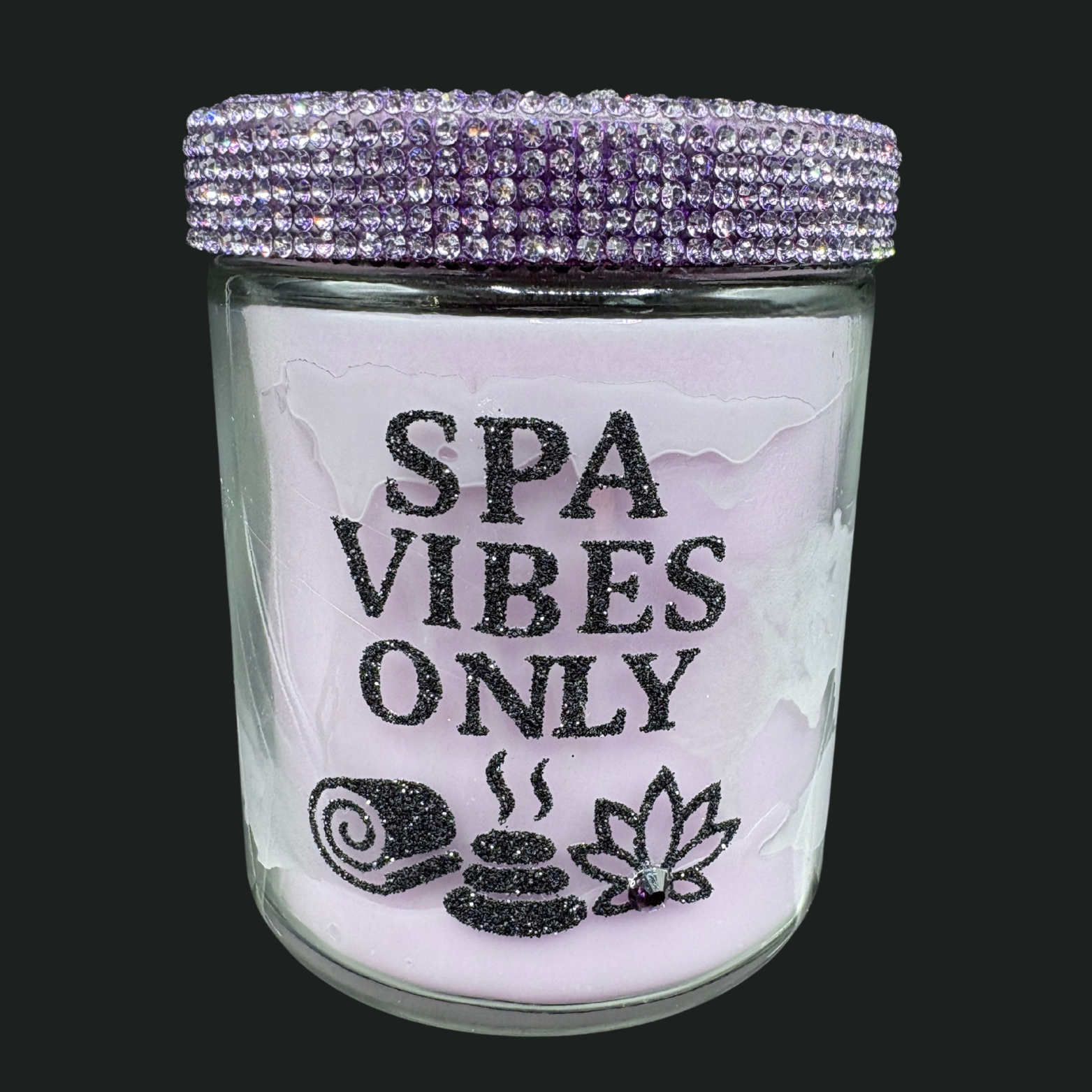Glass jar with 'Spa Vibes Only' text and decorative elements on a black background